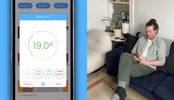 Man sat on sofa using the WundaSmart app to control his underfloor heating